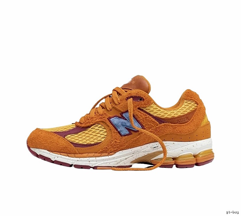 New Balance 2002R retro-style orange shoes